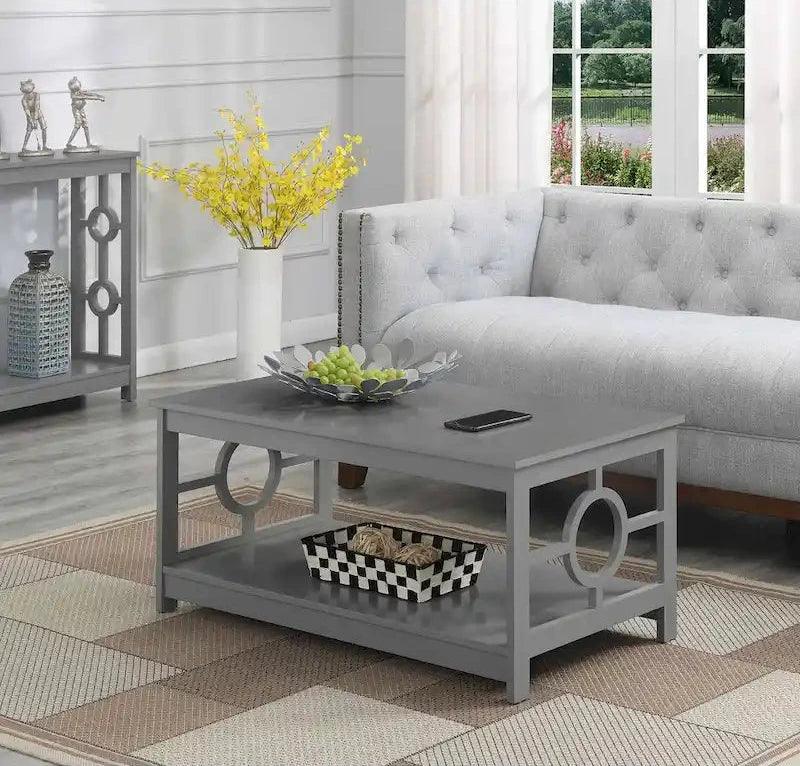Table basse contemporaine avec cadre latéral en forme d'anneau et étagère inférieure