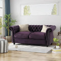 Causeuse Chesterfield capitonnée avec clous décoratifs