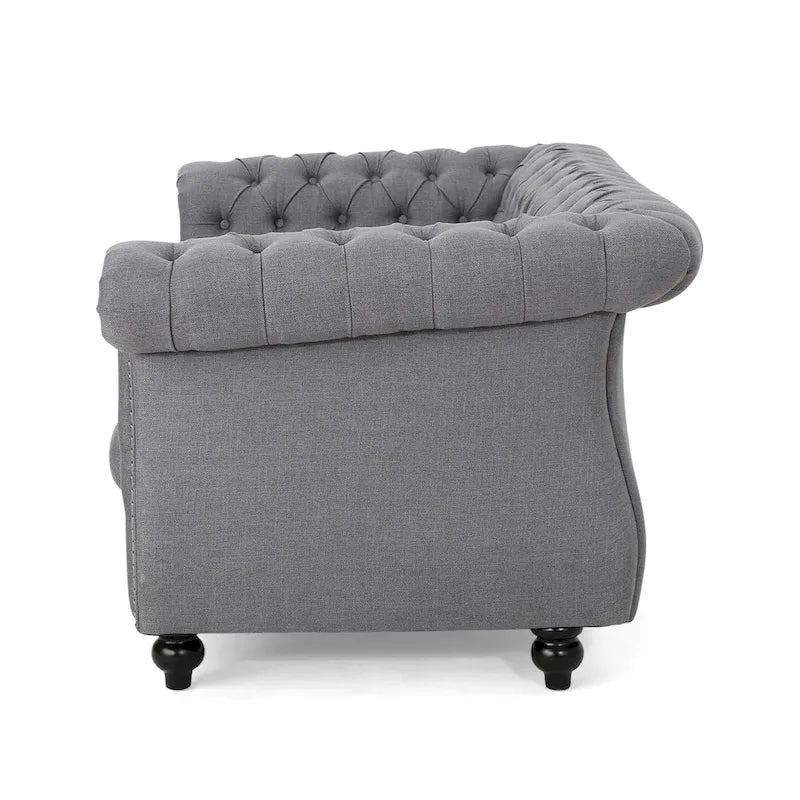 Causeuse Chesterfield capitonnée avec clous décoratifs