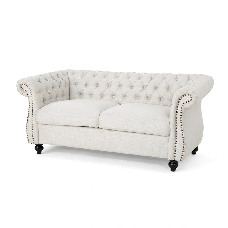 Causeuse Chesterfield capitonnée avec clous décoratifs