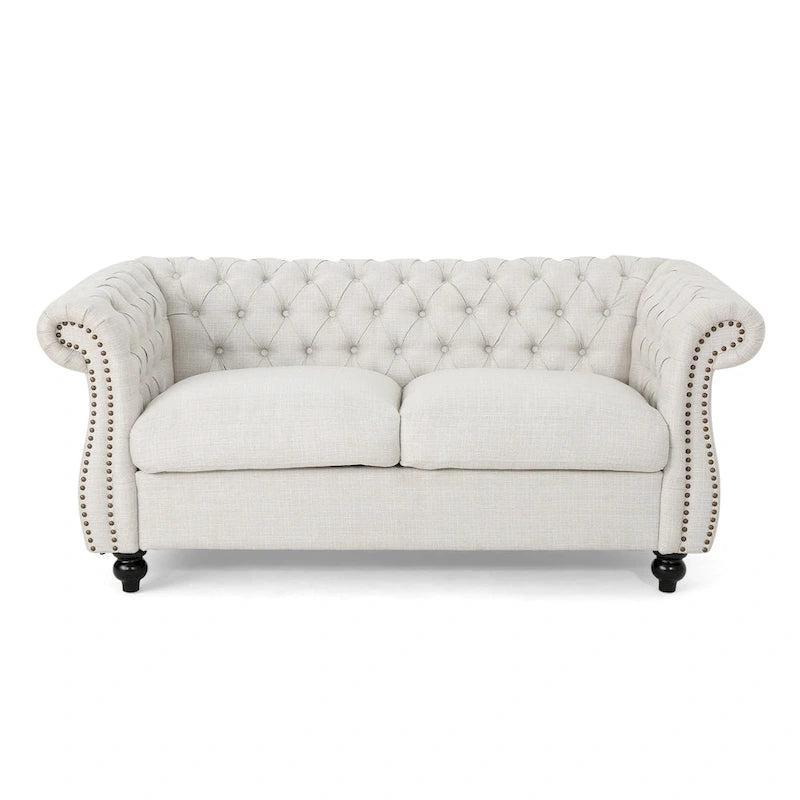 Causeuse Chesterfield capitonnée avec clous décoratifs